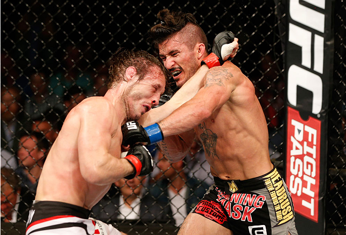 DUBLIN, IRELAND - JULY 19: (R-L) Ian McCall connects with a straight left against Brad Pickett in their flyweight bout during the UFC Fight Night event at The O2 Dublin on July 19, 2014 in Dublin, Ireland. (Photo by Josh Hedges/Zuffa LLC/Zuffa LLC via G