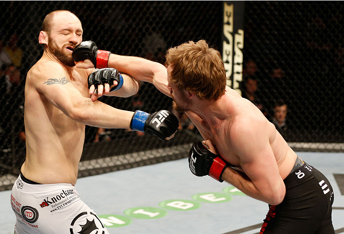 DUBLIN, IRELAND - JULY 19: (R-L) Gunnar Nelson connects with a right to the head of Zak Cummings in their welterweight bout during the UFC Fight Night event at The O2 Dublin on July 19, 2014 in Dublin, Ireland. (Photo by Josh Hedges/Zuffa LLC/Zuffa LLC