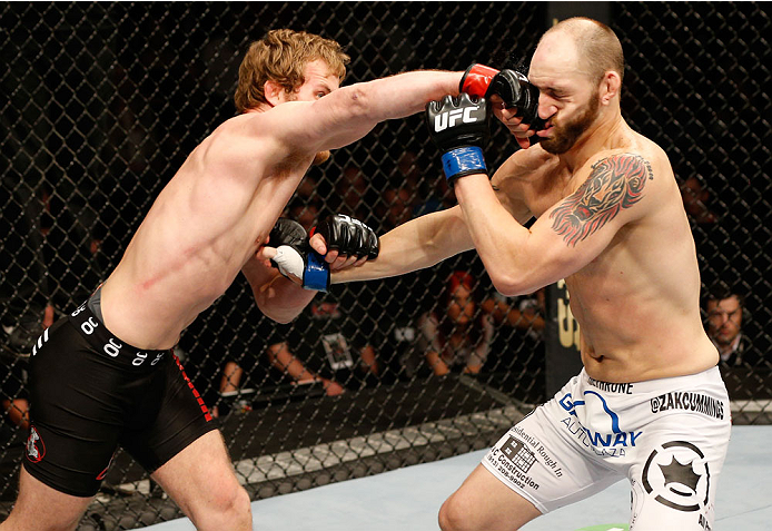 DUBLIN, IRELAND - JULY 19: (L-R) Gunnar Nelson connects with a right to the head of Zak Cummings in their welterweight bout during the UFC Fight Night event at The O2 Dublin on July 19, 2014 in Dublin, Ireland. (Photo by Josh Hedges/Zuffa LLC/Zuffa LLC
