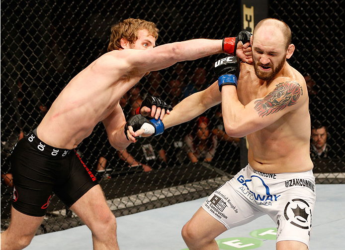 DUBLIN, IRELAND - JULY 19: (L-R) Gunnar Nelson connects with a right to the head of Zak Cummings in their welterweight bout during the UFC Fight Night event at The O2 Dublin on July 19, 2014 in Dublin, Ireland. (Photo by Josh Hedges/Zuffa LLC/Zuffa LLC