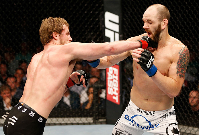 DUBLIN, IRELAND - JULY 19: (L-R) Gunnar Nelson connects with a right to the head of Zak Cummings in their welterweight bout during the UFC Fight Night event at The O2 Dublin on July 19, 2014 in Dublin, Ireland. (Photo by Josh Hedges/Zuffa LLC/Zuffa LLC