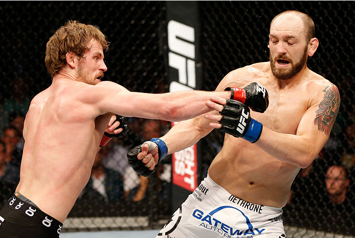 DUBLIN, IRELAND - JULY 19: (L-R) Gunnar Nelson connects with a right to the head of Zak Cummings in their welterweight bout during the UFC Fight Night event at The O2 Dublin on July 19, 2014 in Dublin, Ireland. (Photo by Josh Hedges/Zuffa LLC/Zuffa LLC