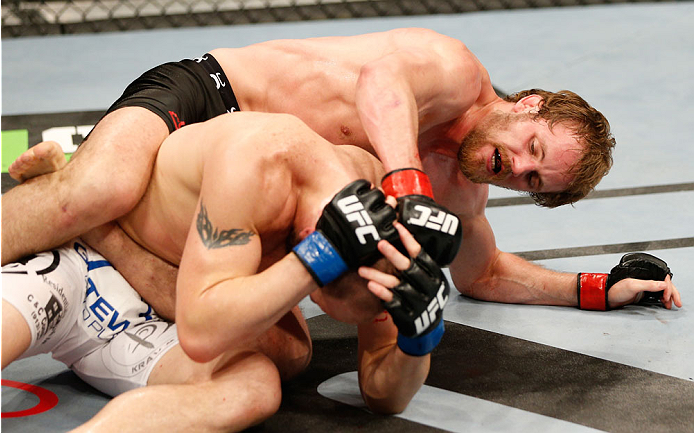DUBLIN, IRELAND - JULY 19: Gunnar Nelson (black trunks) punches Zak Cummings in their welterweight bout during the UFC Fight Night event at The O2 Dublin on July 19, 2014 in Dublin, Ireland. (Photo by Josh Hedges/Zuffa LLC/Zuffa LLC via Getty Images)