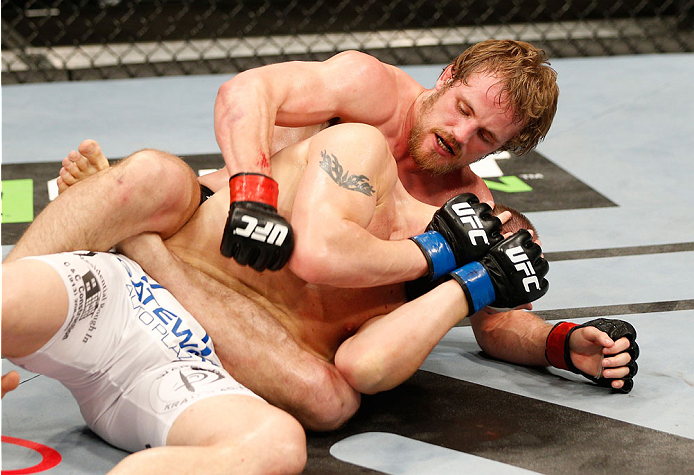 DUBLIN, IRELAND - JULY 19: Gunnar Nelson (black trunks) punches Zak Cummings in their welterweight bout during the UFC Fight Night event at The O2 Dublin on July 19, 2014 in Dublin, Ireland. (Photo by Josh Hedges/Zuffa LLC/Zuffa LLC via Getty Images)