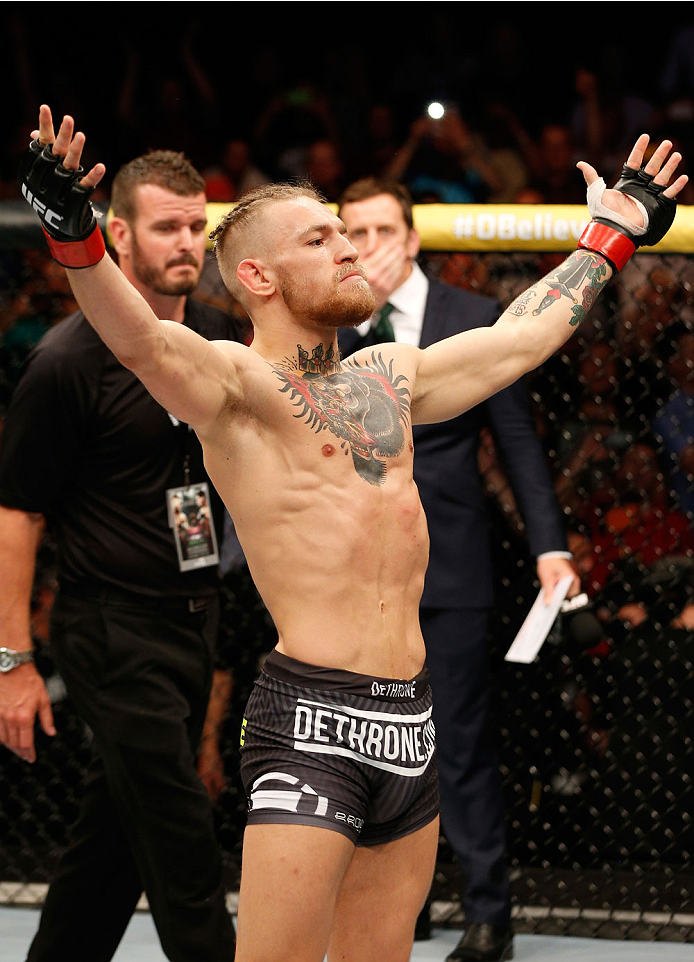 DUBLIN, IRELAND - JULY 19: Conor McGregor enters the Octagon before his featherweight bout against Diego Brandao during the UFC Fight Night event at The O2 Dublin on July 19, 2014 in Dublin, Ireland. (Photo by Josh Hedges/Zuffa LLC/Zuffa LLC via Getty I