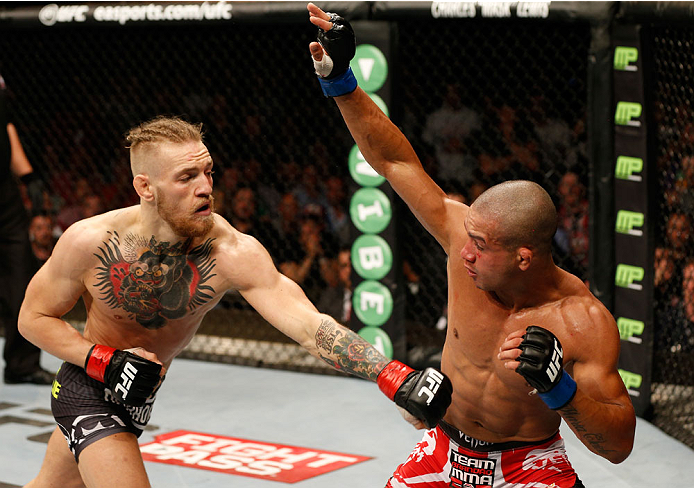 DUBLIN, IRELAND - JULY 19: (L-R) Conor McGregor fires a left at Diego Brandao in their featherweight bout during the UFC Fight Night event at The O2 Dublin on July 19, 2014 in Dublin, Ireland. (Photo by Josh Hedges/Zuffa LLC/Zuffa LLC via Getty Images)