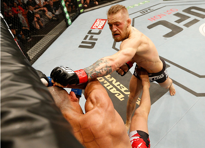 DUBLIN, IRELAND - JULY 19: (R-L) Conor McGregor lands a left to the head of Diego Brandao in their featherweight bout during the UFC Fight Night event at The O2 Dublin on July 19, 2014 in Dublin, Ireland. (Photo by Josh Hedges/Zuffa LLC/Zuffa LLC via Ge