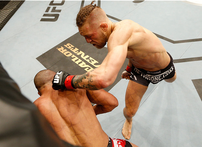 DUBLIN, IRELAND - JULY 19: (R-L) Conor McGregor lands a left to the head of Diego Brandao in their featherweight bout during the UFC Fight Night event at The O2 Dublin on July 19, 2014 in Dublin, Ireland. (Photo by Josh Hedges/Zuffa LLC/Zuffa LLC via Ge