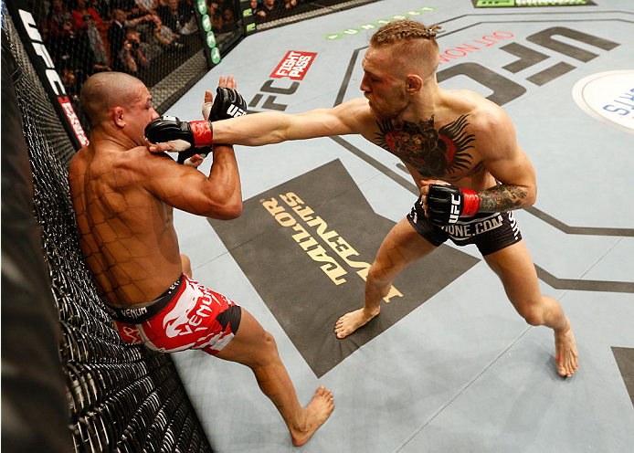 DUBLIN, IRELAND - JULY 19: (R-L) Conor McGregor lands a right to the head of Diego Brandao in their featherweight bout during the UFC Fight Night event at The O2 Dublin on July 19, 2014 in Dublin, Ireland. (Photo by Josh Hedges/Zuffa LLC/Zuffa LLC via G
