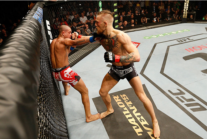 DUBLIN, IRELAND - JULY 19: (R-L) Conor McGregor lands a right to the head of Diego Brandao in their featherweight bout during the UFC Fight Night event at The O2 Dublin on July 19, 2014 in Dublin, Ireland. (Photo by Josh Hedges/Zuffa LLC/Zuffa LLC via G