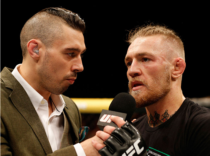 DUBLIN, IRELAND - JULY 19: (R-L) Conor McGregor is interviewed by Dan Hardy after his TKO victory over Diego Brandao in their featherweight bout during the UFC Fight Night event at The O2 Dublin on July 19, 2014 in Dublin, Ireland. (Photo by Josh Hedges
