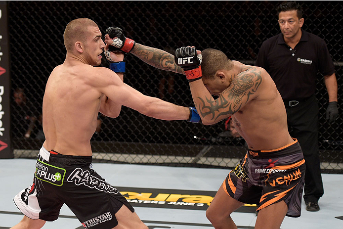 GOIANIA, BRAZIL - MAY 30: Luiz Dutra of Brazil and Tom Breese of England exchange punches in their welterweight UFC bout during the UFC Fight Night Condit v Alves at Arena Goiania on May 30, 2015 in Goiania. (Photo by Buda Mendes/Zuffa LLC/Zuffa LLC vi