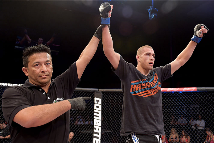 GOIANIA, BRAZIL - MAY 31: Tom Breese of England celebrates his victory over Luiz Dutra of Brazil in their welterweight UFC bout during the UFC Fight Night Condit v Alves at Arena Goiania on May 30, 2015 in Goiania. (Photo by Buda Mendes/Zuffa LLC/Zuffa