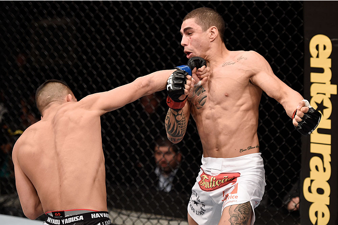 GOIANIA, BRAZIL - MAY 30: Mirsad Bektic of Bosnia punches Lucas Martins of Brazil in their featherweight UFC bout during the UFC Fight Night Condit v Alves at Arena Goiania on May 30, 2015 in Goiania. (Photo by Buda Mendes/Zuffa LLC/Zuffa LLC via Getty