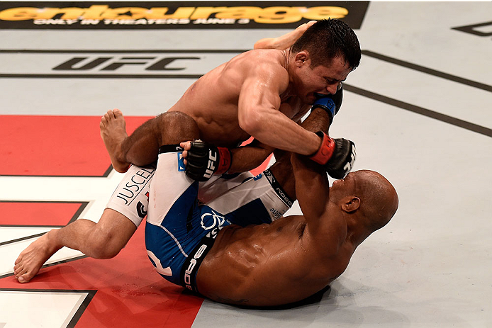 GOIANIA, BRAZIL - MAY 31: Jussier Formiga of Brazil punches Wilson Reis of Brazil in their UFC flyweight bout during the UFC Fight Night Condit v Alves at Arena Goiania on May 30, 2015 in Goiania. (Photo by Buda Mendes/Zuffa LLC/Zuffa LLC via Getty Imag