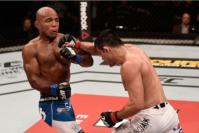 GOIANIA, BRAZIL - MAY 30: Jussier Formiga of Brazil punches Wilson Reis of Brazil in their UFC flyweight bout during the UFC Fight Night Condit v Alves at Arena Goiania on May 30, 2015 in Goiania. (Photo by Buda Mendes/Zuffa LLC/Zuffa LLC via Getty Imag