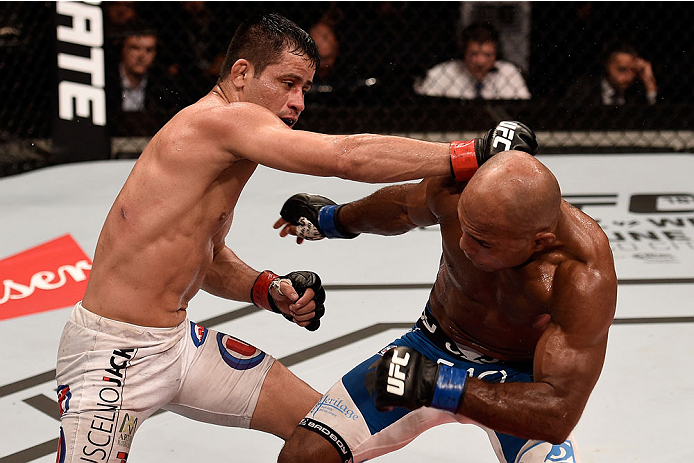 GOIANIA, BRAZIL - MAY 30: Jussier Formiga of Brazil punches Wilson Reis of Brazil in their UFC flyweight bout during the UFC Fight Night Condit v Alves at Arena Goiania on May 30, 2015 in Goiania. (Photo by Buda Mendes/Zuffa LLC/Zuffa LLC via Getty Imag