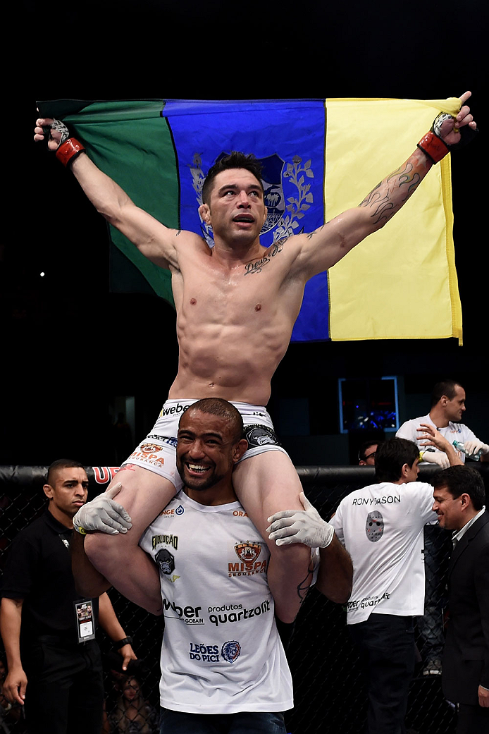 GOIANIA, BRAZIL - MAY 30: Rony Jason of Brazil celebrates victory by submission over Damon Jackson of the United States in their UFC featherweight bout during the UFC Fight Night Condit v Alves at Arena Goiania on May 30, 2015 in Goiania. (Photo by Buda