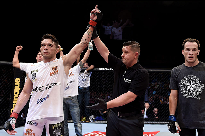 GOIANIA, BRAZIL - MAY 30: Rony Jason of Brazil celebrates victory by submission over Damon Jackson of the United States in their UFC featherweight bout during the UFC Fight Night Condit v Alves at Arena Goiania on May 30, 2015 in Goiania. (Photo by Buda