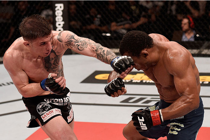 GOIANIA, BRAZIL - MAY 30: Norman Parke of Northern Ireland punches Francisco Trinaldo of Brazil in their lightweight UFC bout during the UFC Fight Night event at Arena Goiania on May 30, 2015 in Goiania. (Photo by Buda Mendes/Zuffa LLC/Zuffa LLC via Get