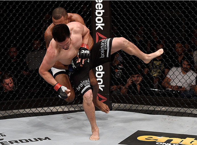 GOIANIA, BRAZIL - MAY 30: Alex Oliveira of Brazil attempts a submission over KJ Noons of the United States in their welterweight UFC bout during the UFC Fight Night event at Arena Goiania on May 30, 2015 in Goiania. (Photo by Buda Mendes/Zuffa LLC/Zuffa