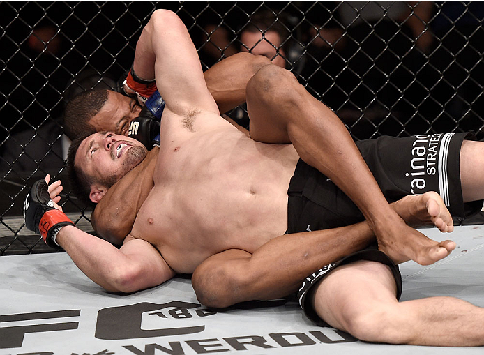 GOIANIA, BRAZIL - MAY 30: Alex Oliveira of Brazil submits KJ Noons of the United States in their welterweight UFC bout during the UFC Fight Night event at Arena Goiania on May 30, 2015 in Goiania. (Photo by Buda Mendes/Zuffa LLC/Zuffa LLC via Getty Imag