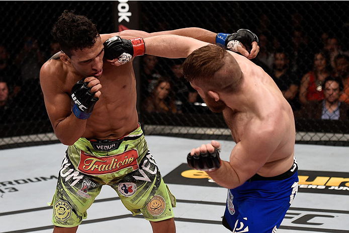 GOIANIA, BRAZIL - MAY 31: Nick Lentz of the United States punches Charles Oliveira of Brazil in their featherweight UFC bout during the UFC Fight Night event at Arena Goiania on May 30, 2015 in Goiania, Brazil. (Photo by Buda Mendes/Zuffa LLC/Zuffa LLC