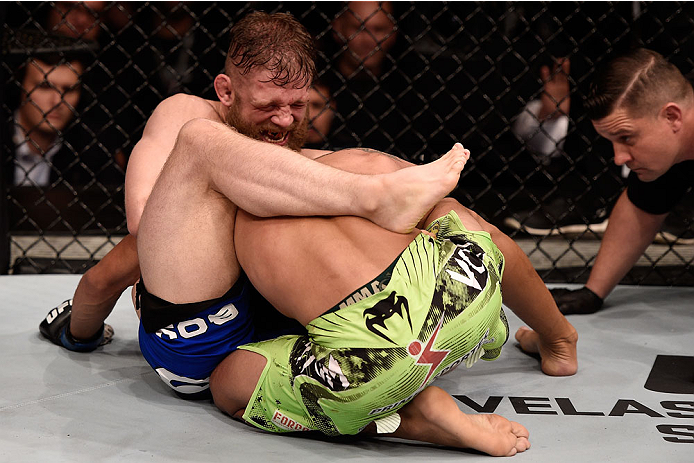 GOIANIA, BRAZIL - MAY 31: Nick Lentz of the United States and Charles Oliveira of Brazil in their featherweight UFC bout during the UFC Fight Night event at Arena Goiania on May 30, 2015 in Goiania, Brazil. (Photo by Buda Mendes/Zuffa LLC/Zuffa LLC via