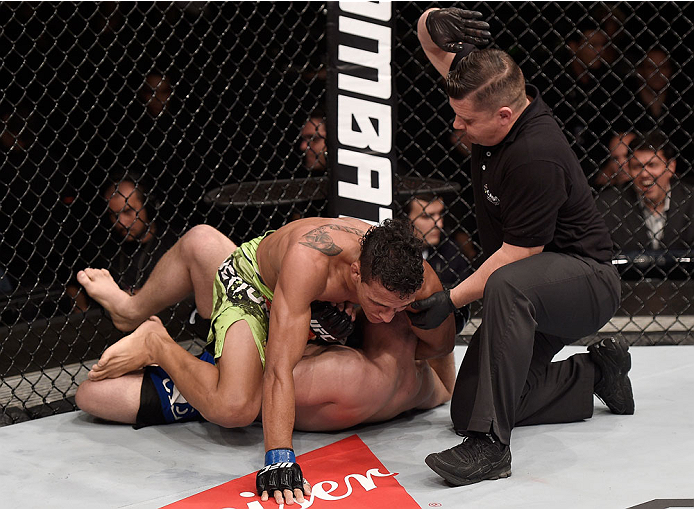 GOIANIA, BRAZIL - MAY 30: Charles Oliveira submits Nick Lentz of the United States in their featherweight UFC bout during the UFC Fight Night event at Arena Goiania on May 30, 2015 in Goiania, Brazil. (Photo by Buda Mendes/Zuffa LLC/Zuffa LLC via Getty