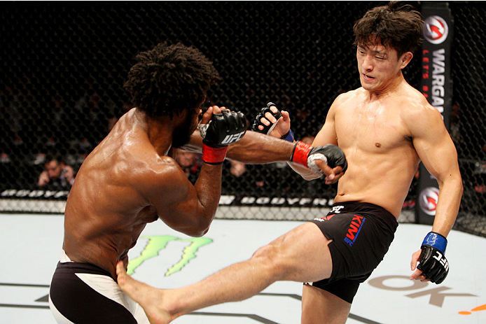 SEOUL, SOUTH KOREA - NOVEMBER 28: Dong Hyun Kim of South Korea kicks Dominique Steele of the United States of America in their lightweight bout during the UFC Fight Night at the Olympic Park Gymnastics Arena on November 28, 2015 in Seoul, South Korea. (Ph