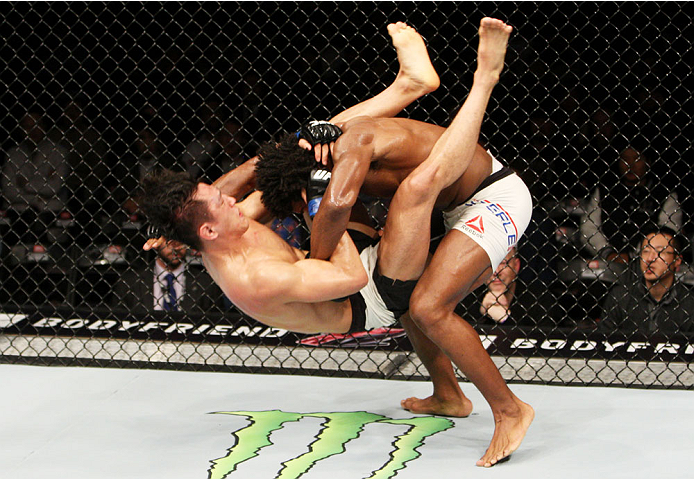 SEOUL, SOUTH KOREA - NOVEMBER 28: Dominique Steele of the United States of America slams Dong Hyun Kim of South Korea which led to a knockout in their lightweight bout during the UFC Fight Night at the Olympic Park Gymnastics Arena on November 28, 2015 i