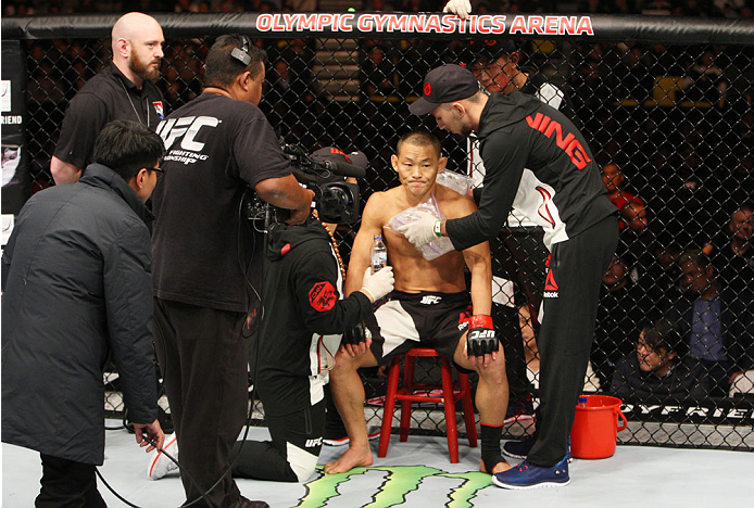 SEOUL, SOUTH KOREA - NOVEMBER 28: Ning Guangyou of China between rounds with his corner during the UFC Fight Night at the Olympic Park Gymnastics Arena on November 28, 2015 in Seoul, South Korea. (Photo by Mitch Viquez/Zuffa LLC/Zuffa LLC via Getty Images