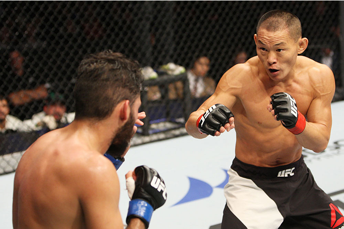 SEOUL, SOUTH KOREA - NOVEMBER 28: Ning Guangyou of China looks for an opening on Marco Beltran of Mexico in their bantamweight bout during the UFC Fight Night at the Olympic Park Gymnastics Arena on November 28, 2015 in Seoul, South Korea. (Photo by Mitch