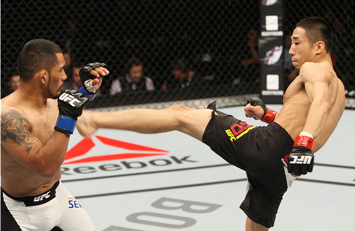 SEOUL, SOUTH KOREA - NOVEMBER 28: Yao Zhikui of China throws a kick at Fredy Serrano of Colombia in their flyweight bout during the UFC Fight Night at the Olympic Park Gymnastics Arena on November 28, 2015 in Seoul, South Korea. (Photo by Mitch Viquez/Z