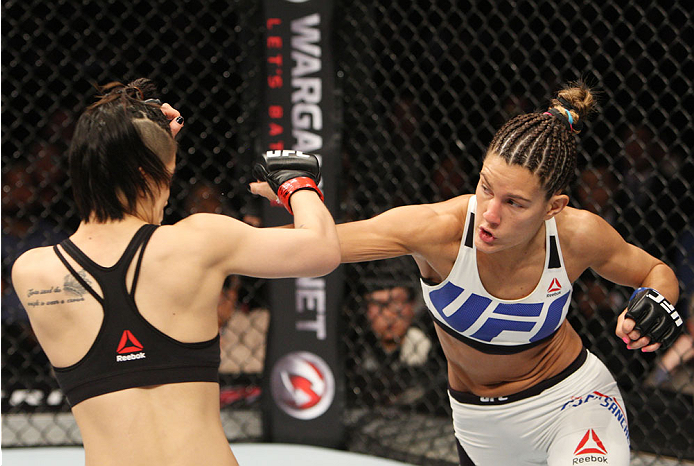SEOUL, SOUTH KOREA - NOVEMBER 28: Cortney Casey of the United States of America throws a punch at Seohee Ham of South Korea in their strawweight bout during the UFC Fight Night at the Olympic Park Gymnastics Arena on November 28, 2015 in Seoul, South Ko
