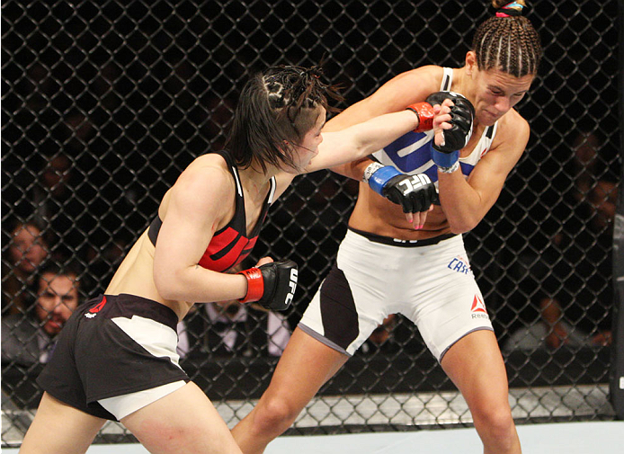SEOUL, SOUTH KOREA - NOVEMBER 28: Seohee Ham of South Korea punches Cortney Casey of the United States of America\ in their strawweight bout during the UFC Fight Night at the Olympic Park Gymnastics Arena on November 28, 2015 in Seoul, South Korea. (Phot