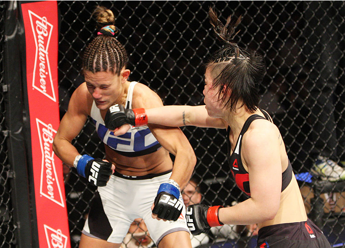 SEOUL, SOUTH KOREA - NOVEMBER 28: Seohee Ham of South Korea punches Cortney Casey of the United States of America in their strawweight bout during the UFC Fight Night at the Olympic Park Gymnastics Arena on November 28, 2015 in Seoul, South Korea. (Photo