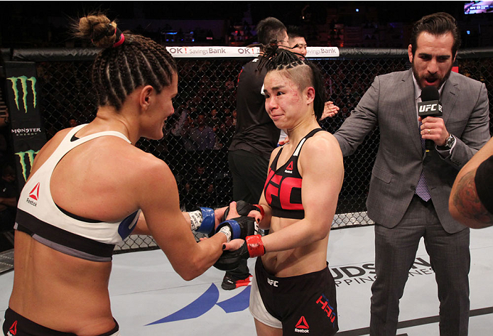 SEOUL, SOUTH KOREA - NOVEMBER 28: (From L to R) Cortney Casey of the United States of America and Seohee Ham of South Korea talk after their strawweight bout during the UFC Fight Night at the Olympic Park Gymnastics Arena on November 28, 2015 in Seoul,