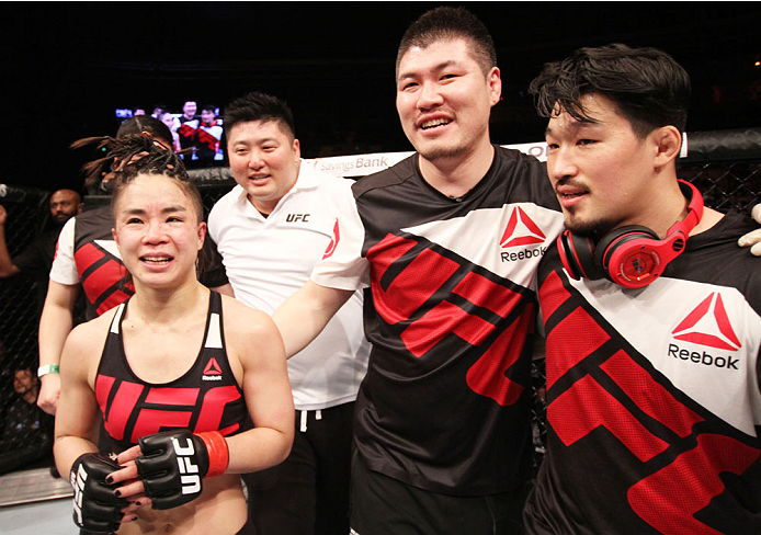 SEOUL, SOUTH KOREA - NOVEMBER 28: Seohee Ham of South Korea and her team after her victory over Cortney Casey of the United States of America in their strawweight bout during the UFC Fight Night at the Olympic Park Gymnastics Arena on November 28, 2015 i