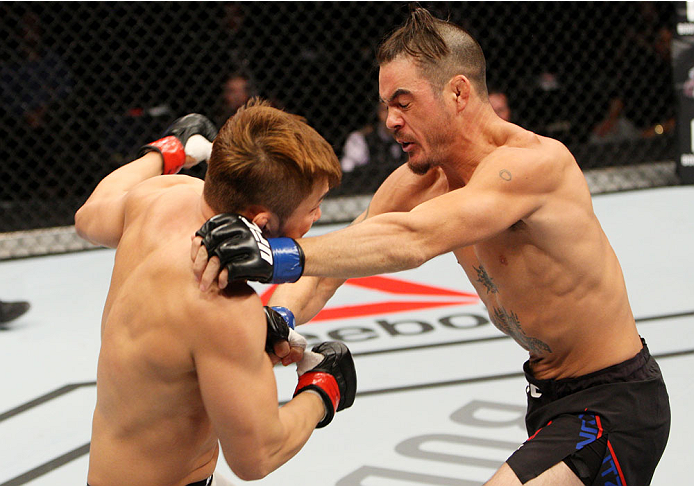 SEOUL, SOUTH KOREA - NOVEMBER 28: (From L to R) Tae Hyun Bang of South Korea and Leo Kuntz of the United States of America exchange punches in their lightweight bout during the UFC Fight Night at the Olympic Park Gymnastics Arena on November 28, 2015 in