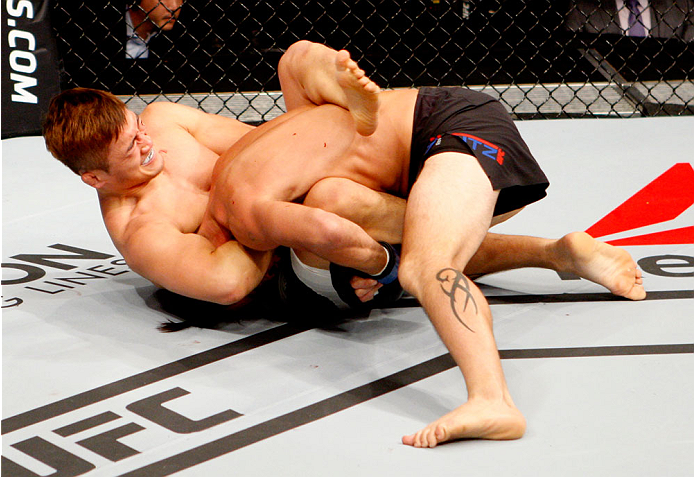 SEOUL, SOUTH KOREA - NOVEMBER 28: Tae Hyun Bang of South Korea goes for a submission on Leo Kuntz of the United States of America in their lightweight bout during the UFC Fight Night at the Olympic Park Gymnastics Arena on November 28, 2015 in Seoul, Sou
