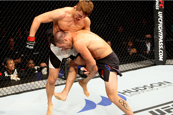 SEOUL, SOUTH KOREA - NOVEMBER 28: Leo Kuntz of the United States of America goes for a takedown on Tae Hyun Bang of South Korea in their lightweight bout during the UFC Fight Night at the Olympic Park Gymnastics Arena on November 28, 2015 in Seoul, South