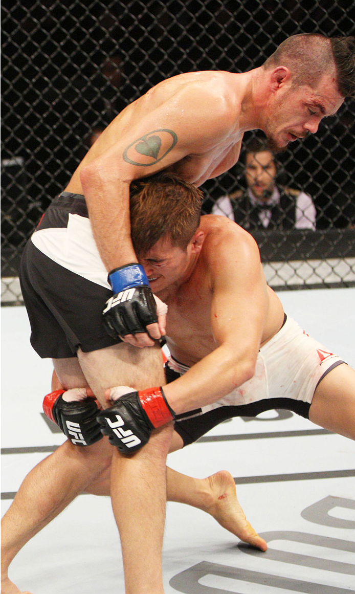 SEOUL, SOUTH KOREA - NOVEMBER 28: Tae Hyun Bang of South Korea shoots for a takedown on Leo Kuntz of the United States of America in their lightweight bout during the UFC Fight Night at the Olympic Park Gymnastics Arena on November 28, 2015 in Seoul, So