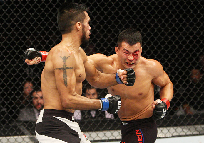 SEOUL, SOUTH KOREA - NOVEMBER 28: (From L to R) Mike De La Torre of the United States of America and Yui Chul Nam of South Korea exchange punches in their featherweight bout during the UFC Fight Night at the Olympic Park Gymnastics Arena on November 28,