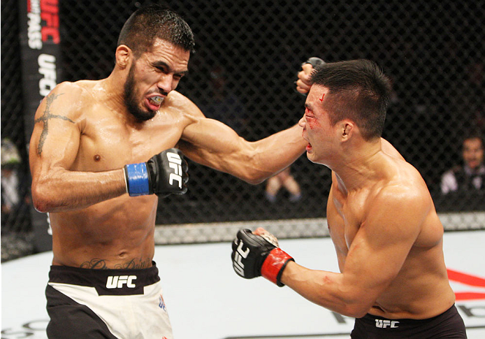 SEOUL, SOUTH KOREA - NOVEMBER 28: (From L to R) Mike De La Torre of the United States of America and Yui Chul Nam of South Korea exchange punches in their featherweight bout during the UFC Fight Night at the Olympic Park Gymnastics Arena on November 28,