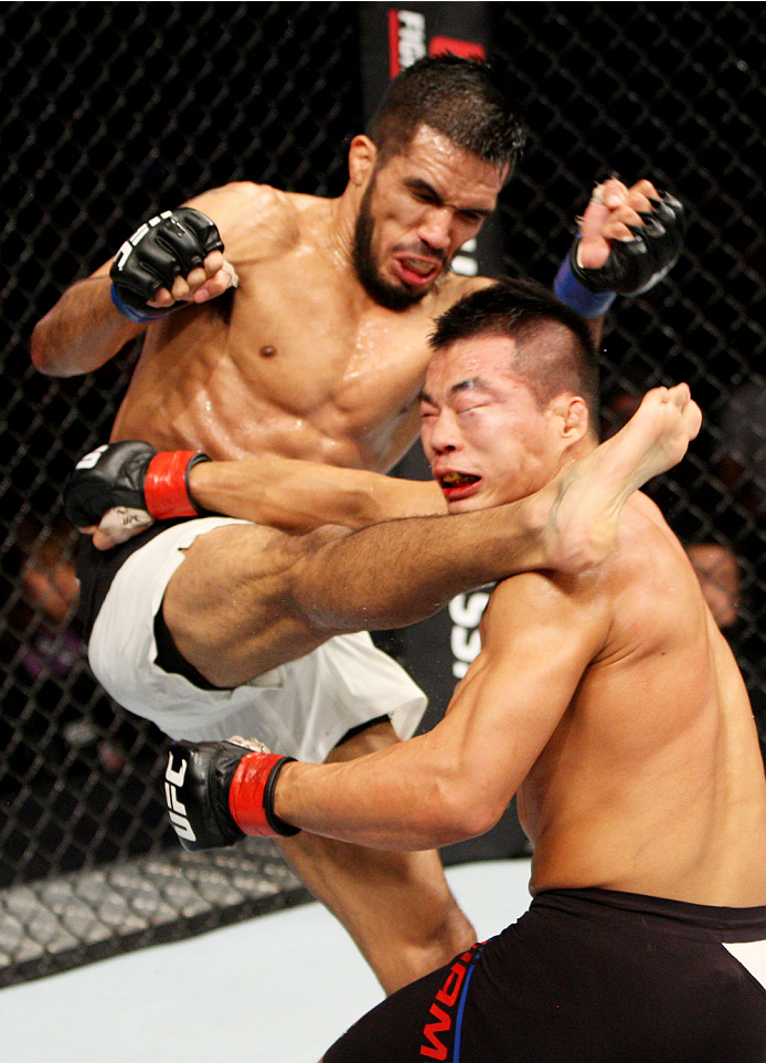 SEOUL, SOUTH KOREA - NOVEMBER 28: Mike De La Torre of the United States of America kicks Yui Chul Nam of South Korea in their featherweight bout during the UFC Fight Night at the Olympic Park Gymnastics Arena on November 28, 2015 in Seoul, South Korea. (