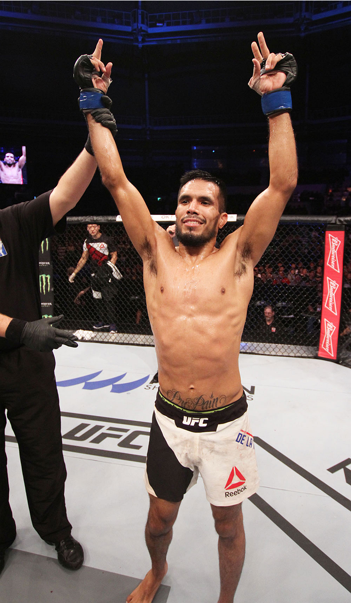 SEOUL, SOUTH KOREA - NOVEMBER 28: Mike De La Torre of the United States of America reacts after his win over Yui Chul Nam of South Korea in their featherweight bout during the UFC Fight Night at the Olympic Park Gymnastics Arena on November 28, 2015 in S