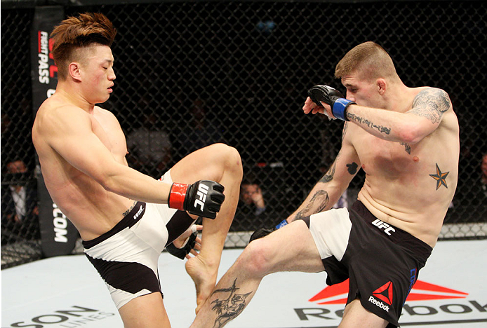 SEOUL, SOUTH KOREA - NOVEMBER 28: Jake Collier of the United States of America kicks Dongi Yang of South Korea in their middleweight bout during the UFC Fight Night at the Olympic Park Gymnastics Arena on November 28, 2015 in Seoul, South Korea. (Photo b