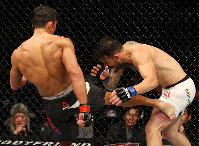 SEOUL, SOUTH KOREA - NOVEMBER 28: Yoshihiro Akiyama of Japan kicks Alberto Mina of Brazil in their welterweight bout during the UFC Fight Night at the Olympic Park Gymnastics Arena on November 28, 2015 in Seoul, South Korea. (Photo by Mitch Viquez/Zuffa