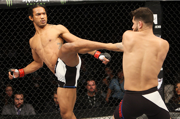 SEOUL, SOUTH KOREA - NOVEMBER 28: Benson Henderson of the United States of America throws a kick at Jorge Masvidal of the United States of America in their welterweight bout during the UFC Fight Night at the Olympic Park Gymnastics Arena on November 28, 2